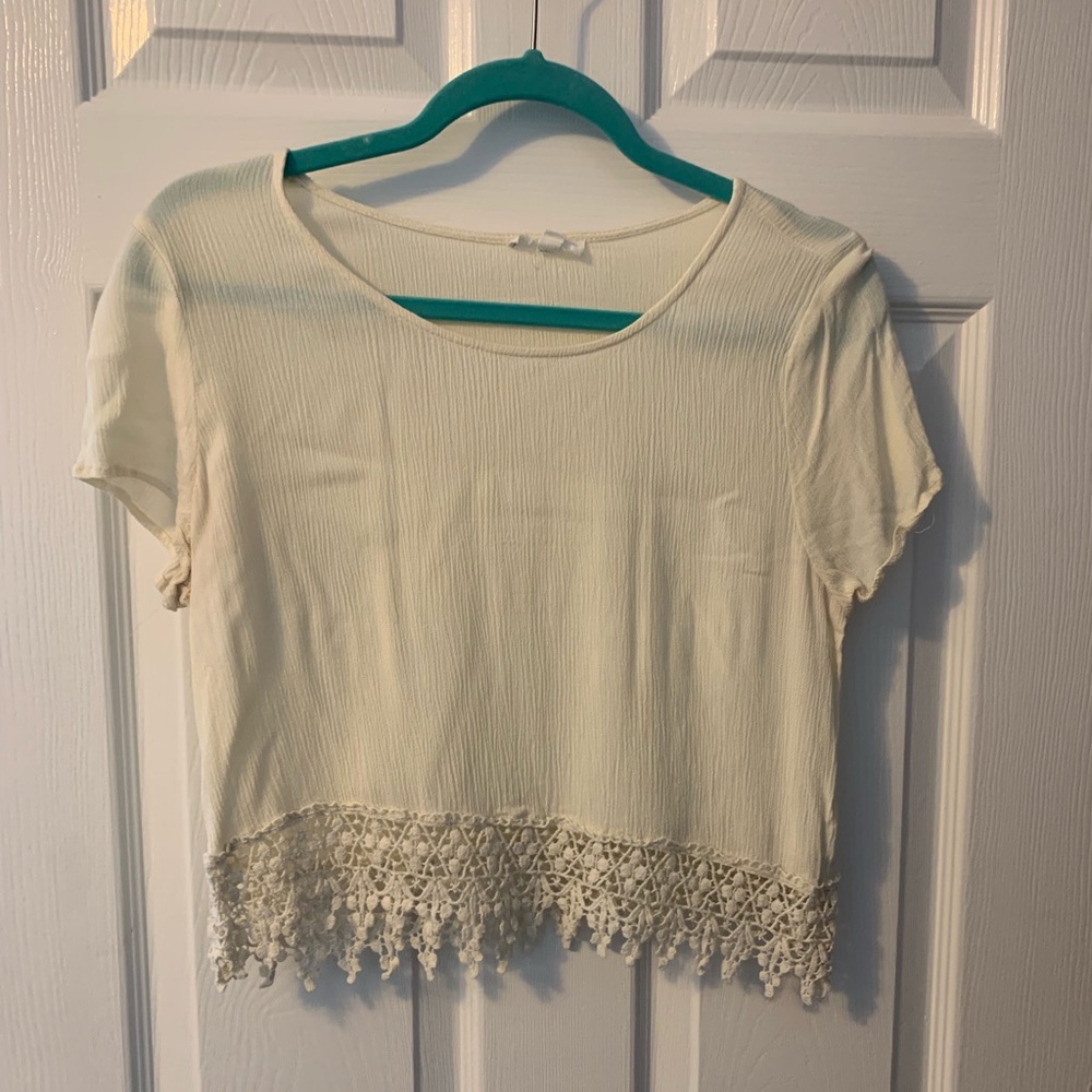Cream colored crop top with lace bottom